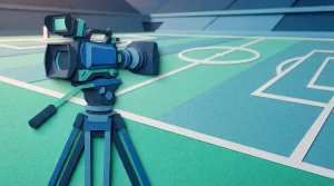 Kamera auf einem Stativ an der Seitenlinie eines Sportplatzes